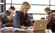 female student working at laptop