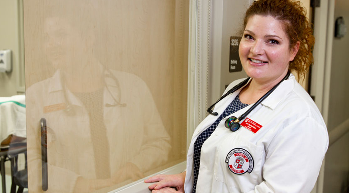 FMAT student in white coat