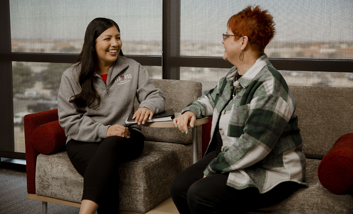 A student and coordinator having a friendly conversation