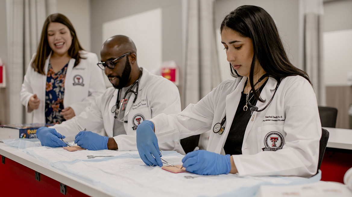 PA Students work on suture techniques in class