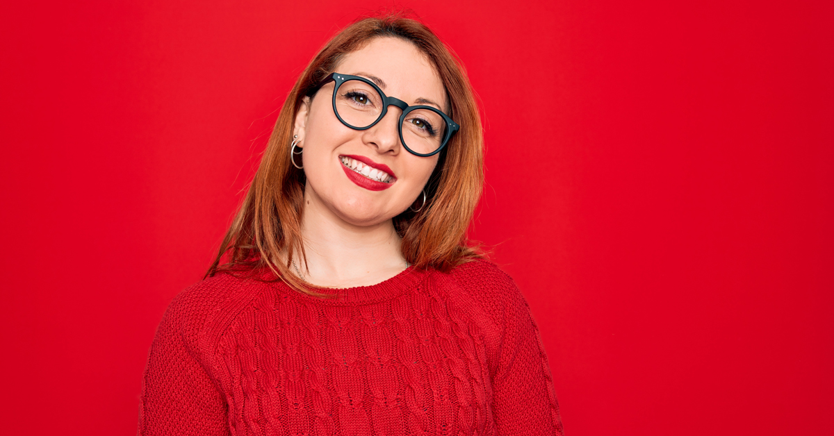 woman in red sweater smiling