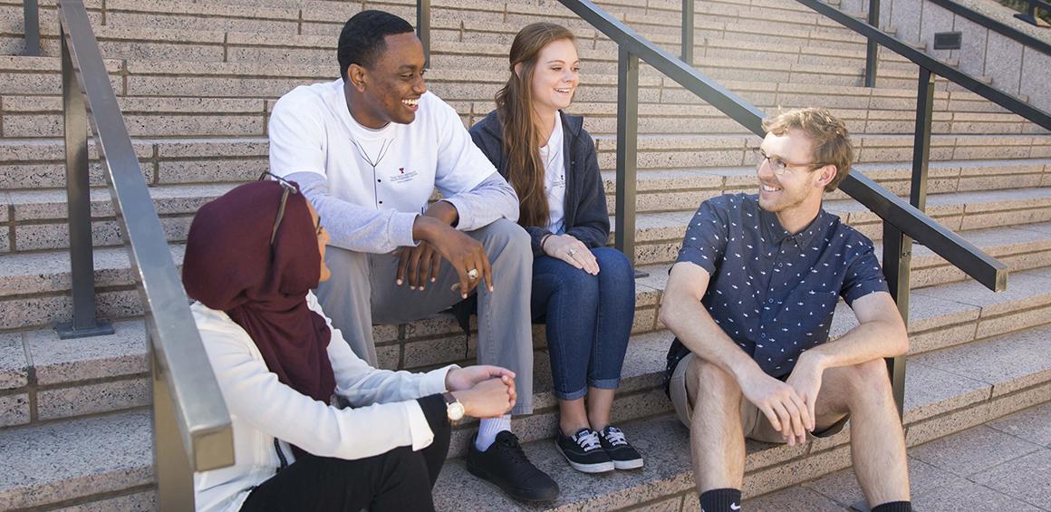 Medical students sitting on steps