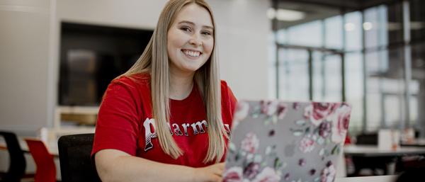 Pharmacy Student with a Laptop