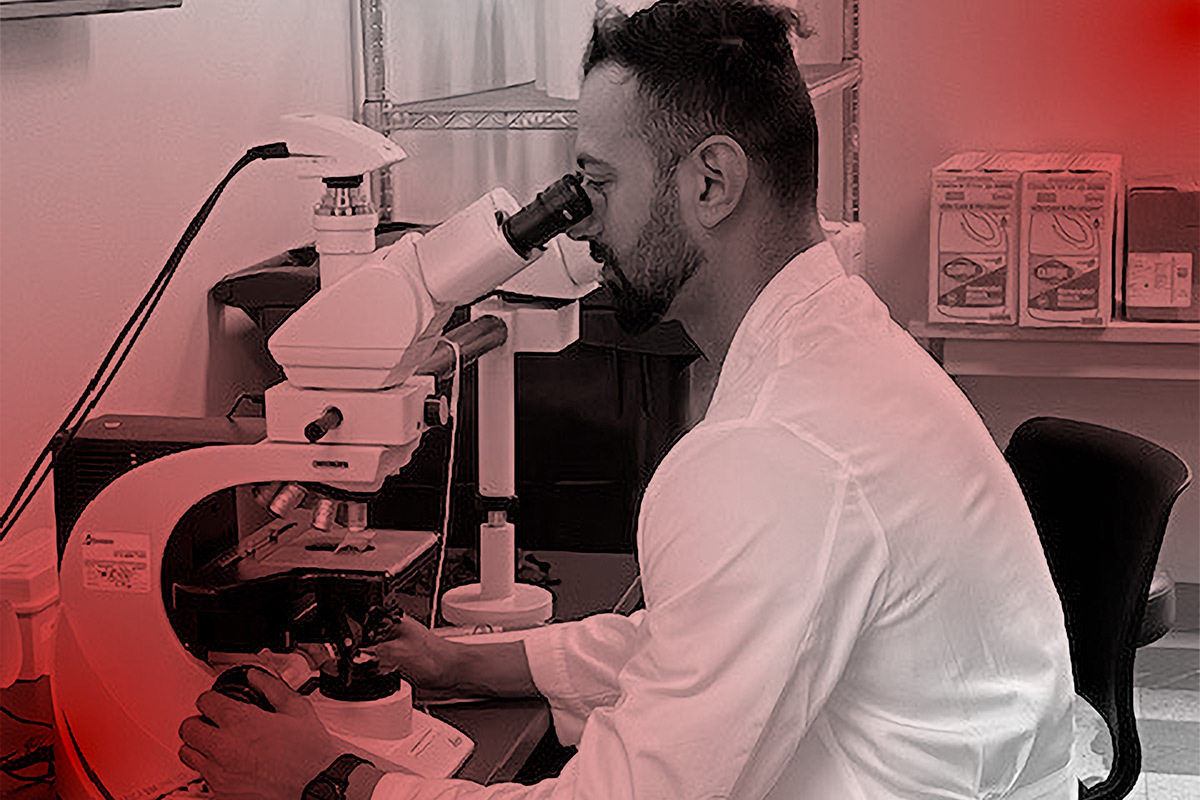 Pathologist examining biopsy at our pathology lab