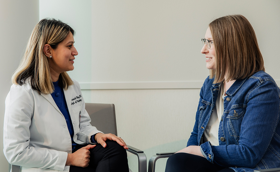 provider sitting with a patient talking