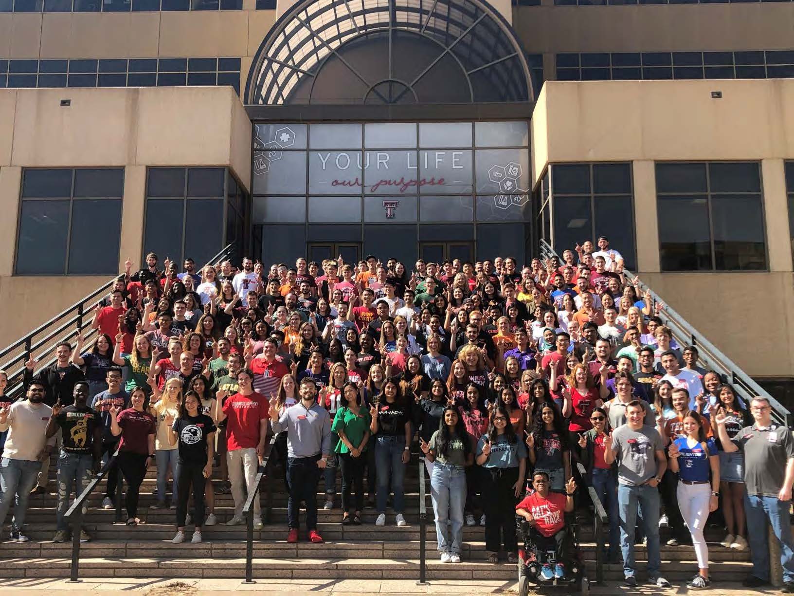 Class of 2025 Students on stairs in front of building