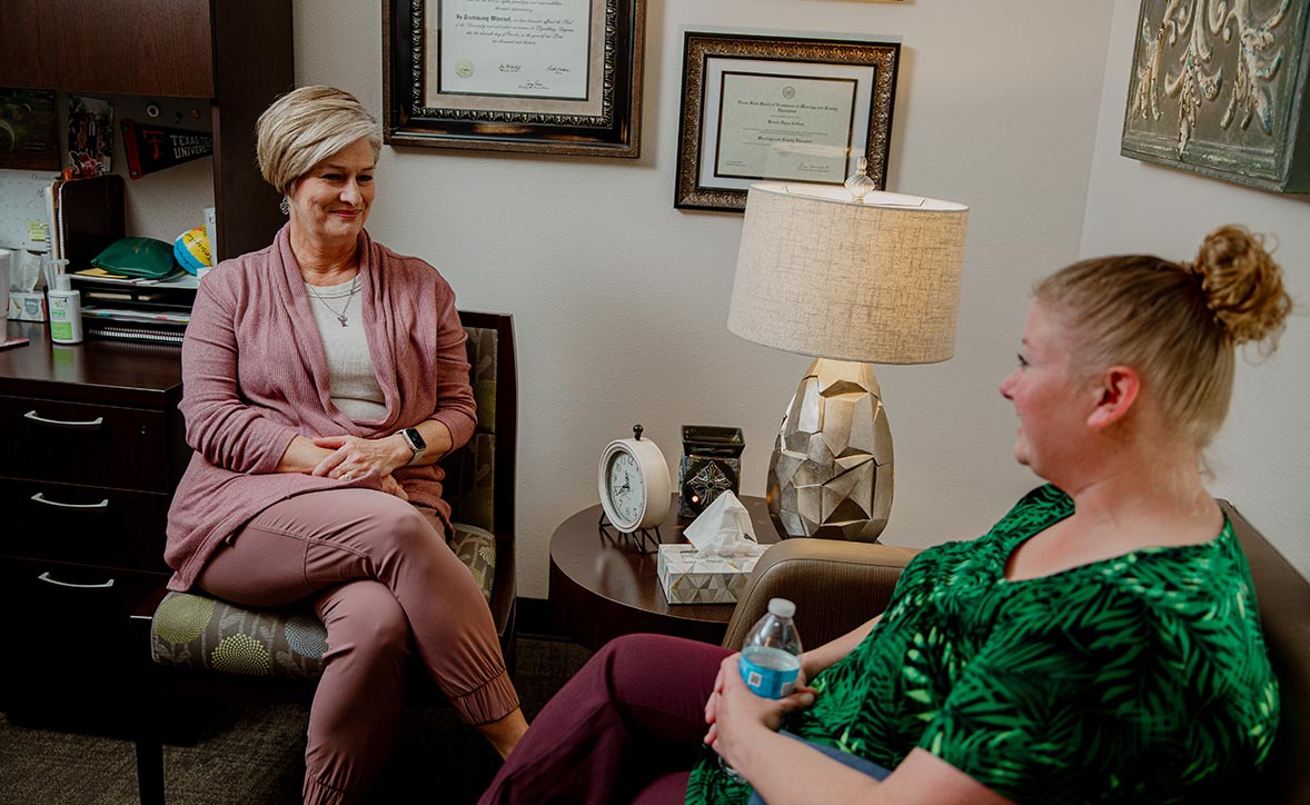 provider sitting with a patient 