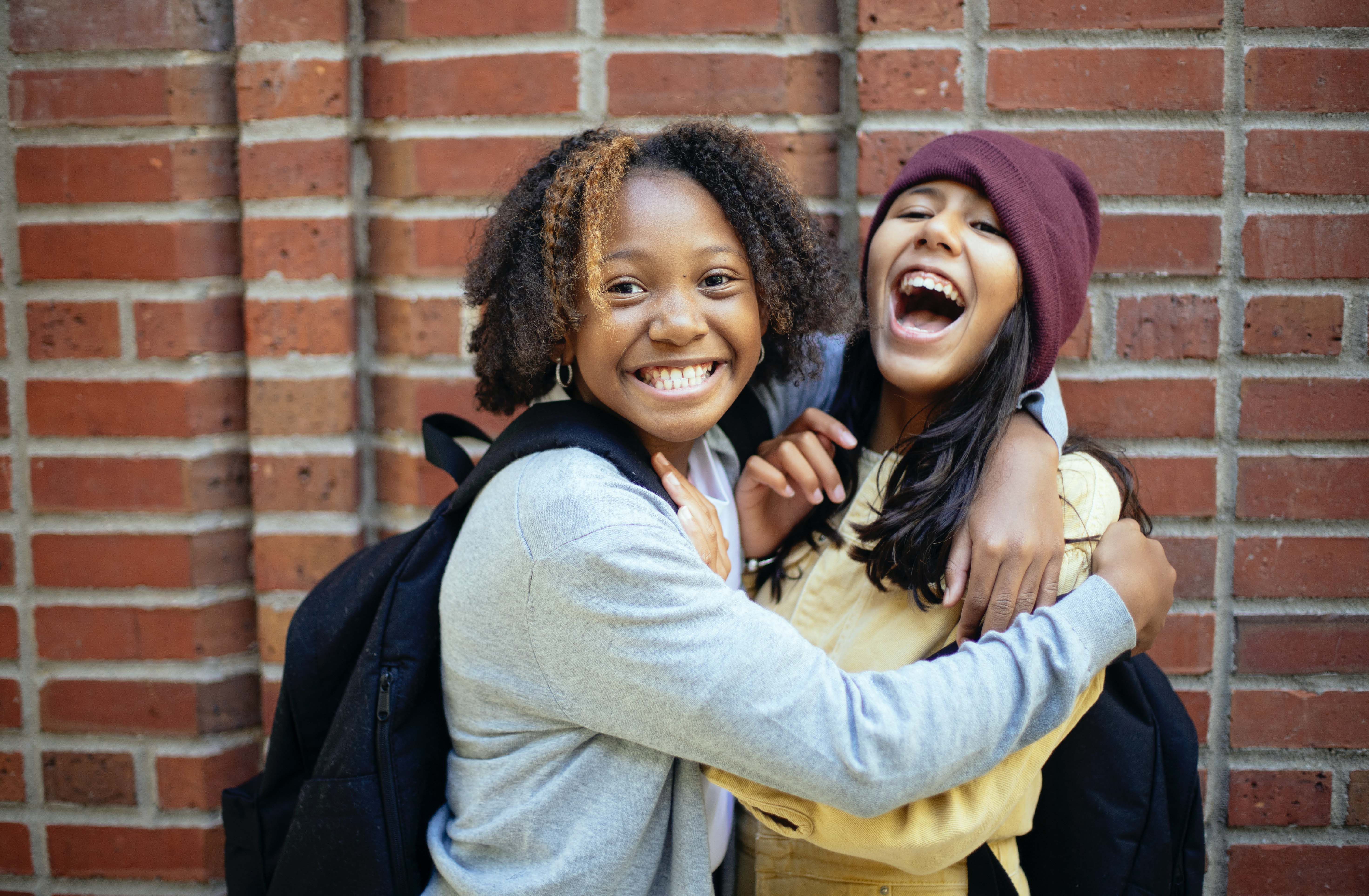 Young girls smiling at school