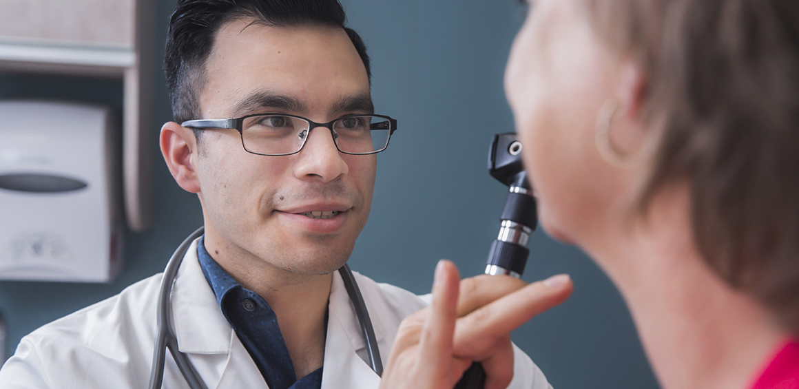 Doctor examining patient, patient care