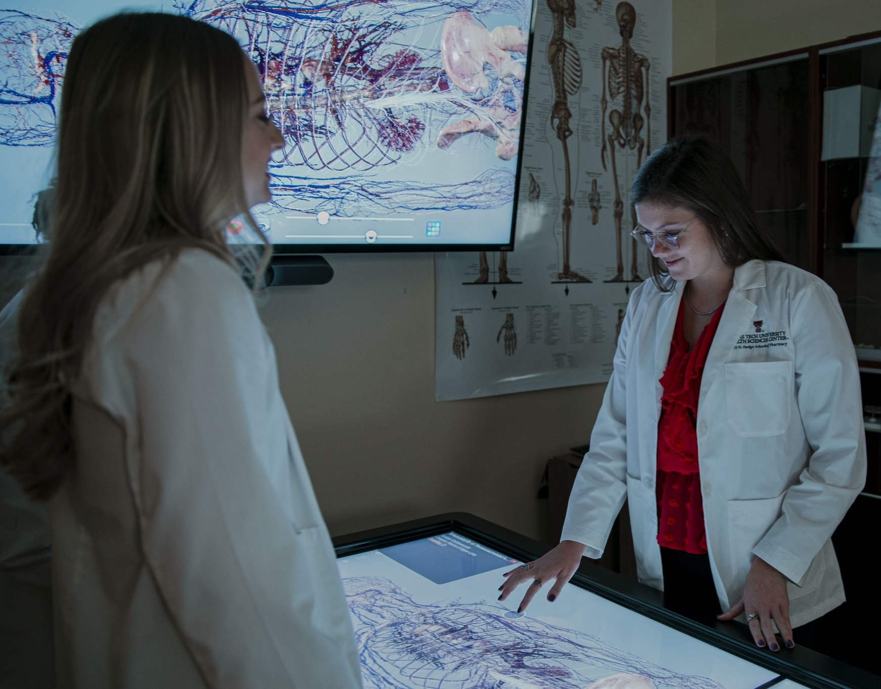 pharmacy students learning with anatomage table