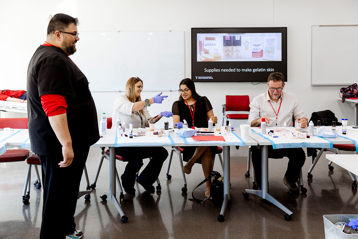 People applying makeup to skin