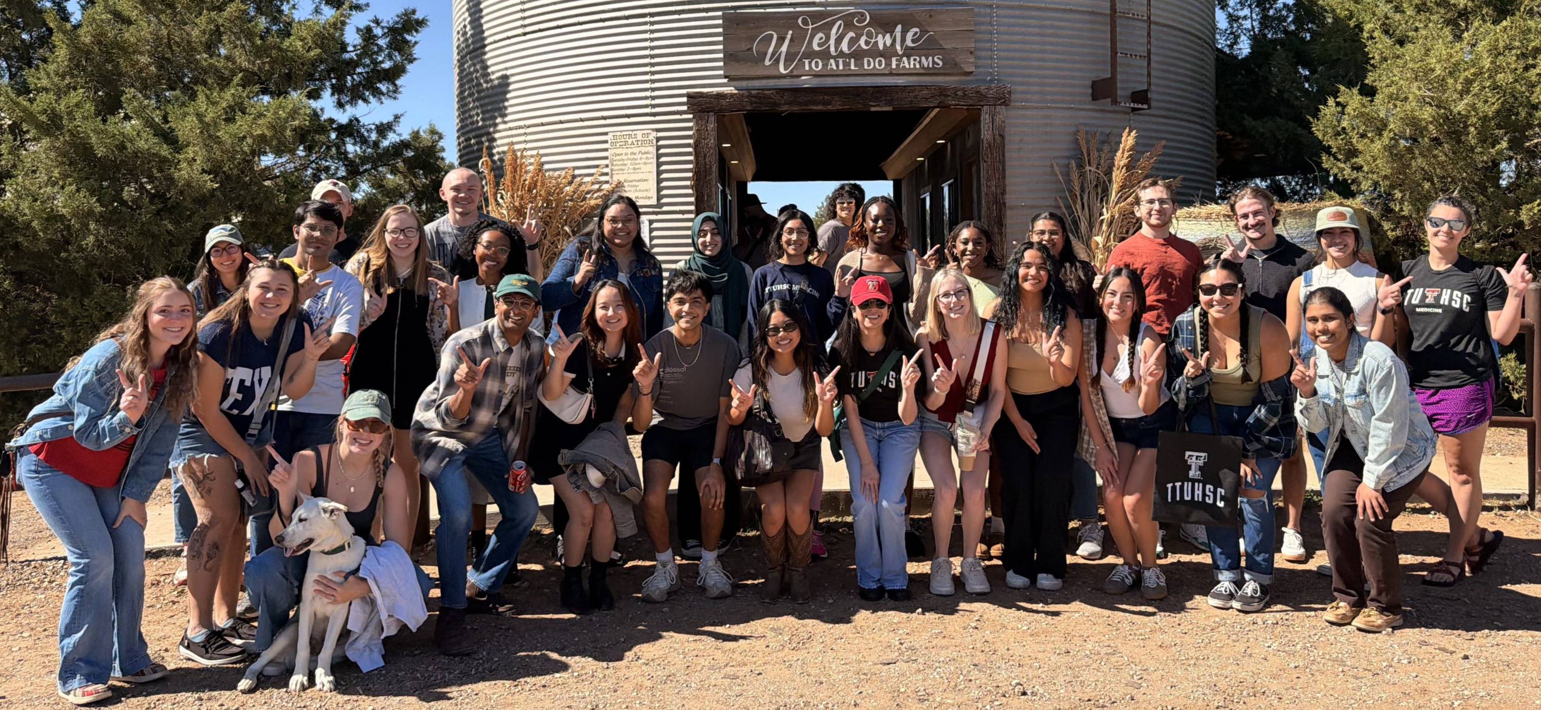 Students in front of the entrance to the At'l Do Corn Maze