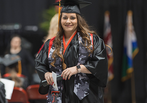 TTUHSC veteran graduate with camo stole on
