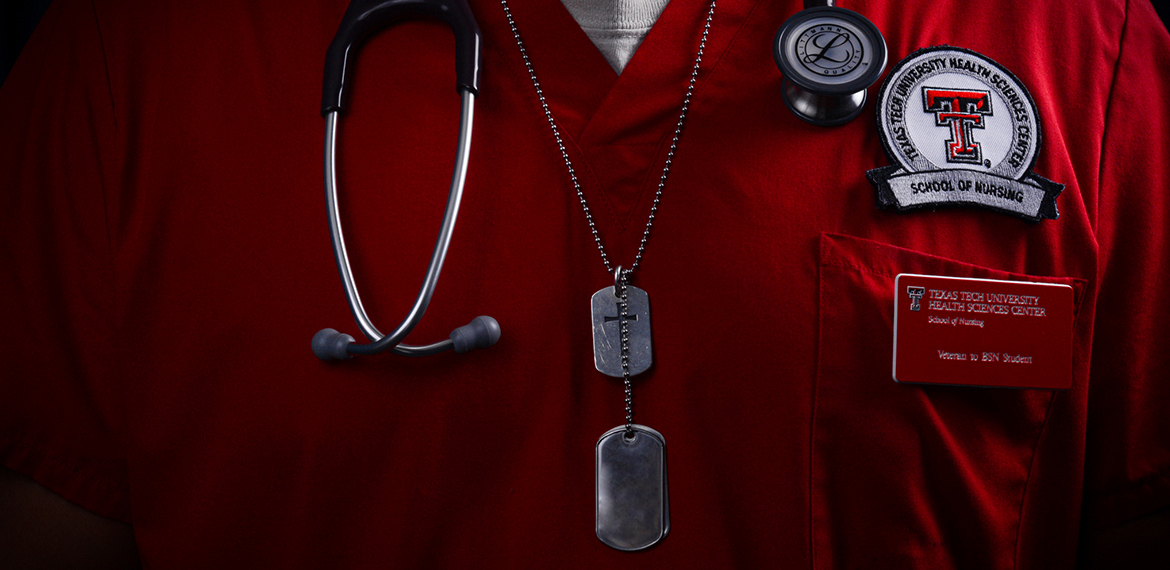 a veteran student in red scrubs